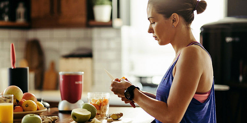 a woman preparing healthy foods a woman preparing healthy foods