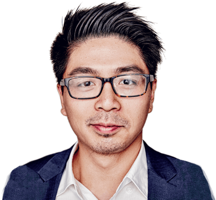 A man wearing glasses and smiling